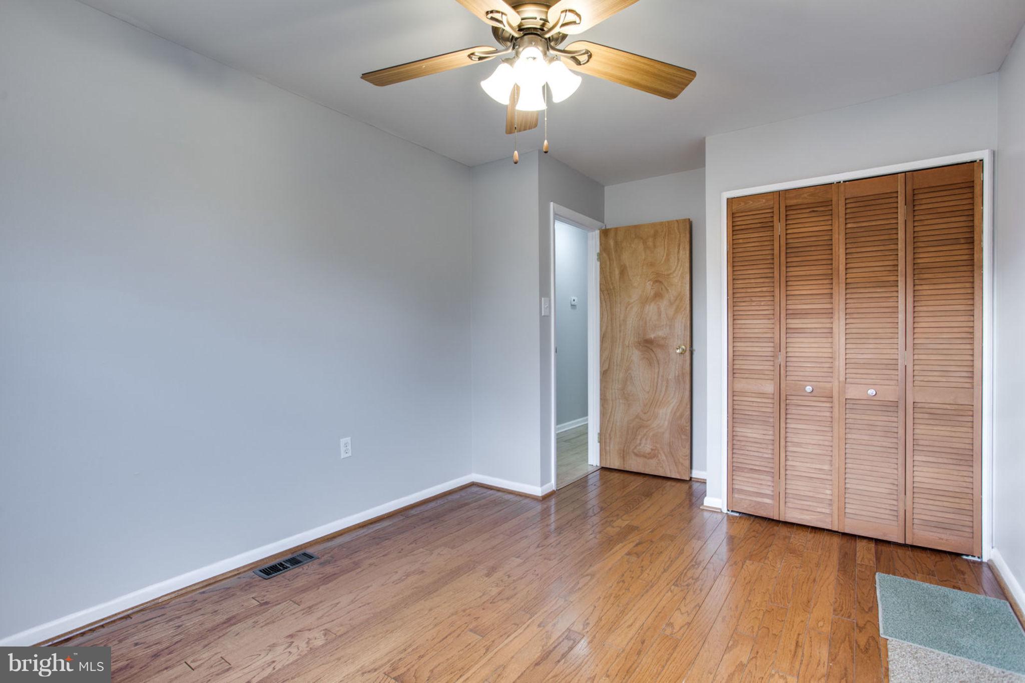 1625 Thomas Drive Point of Rocks, MD 21777 - Photo 27 of 47 an empty room with wooden floor closet and windows