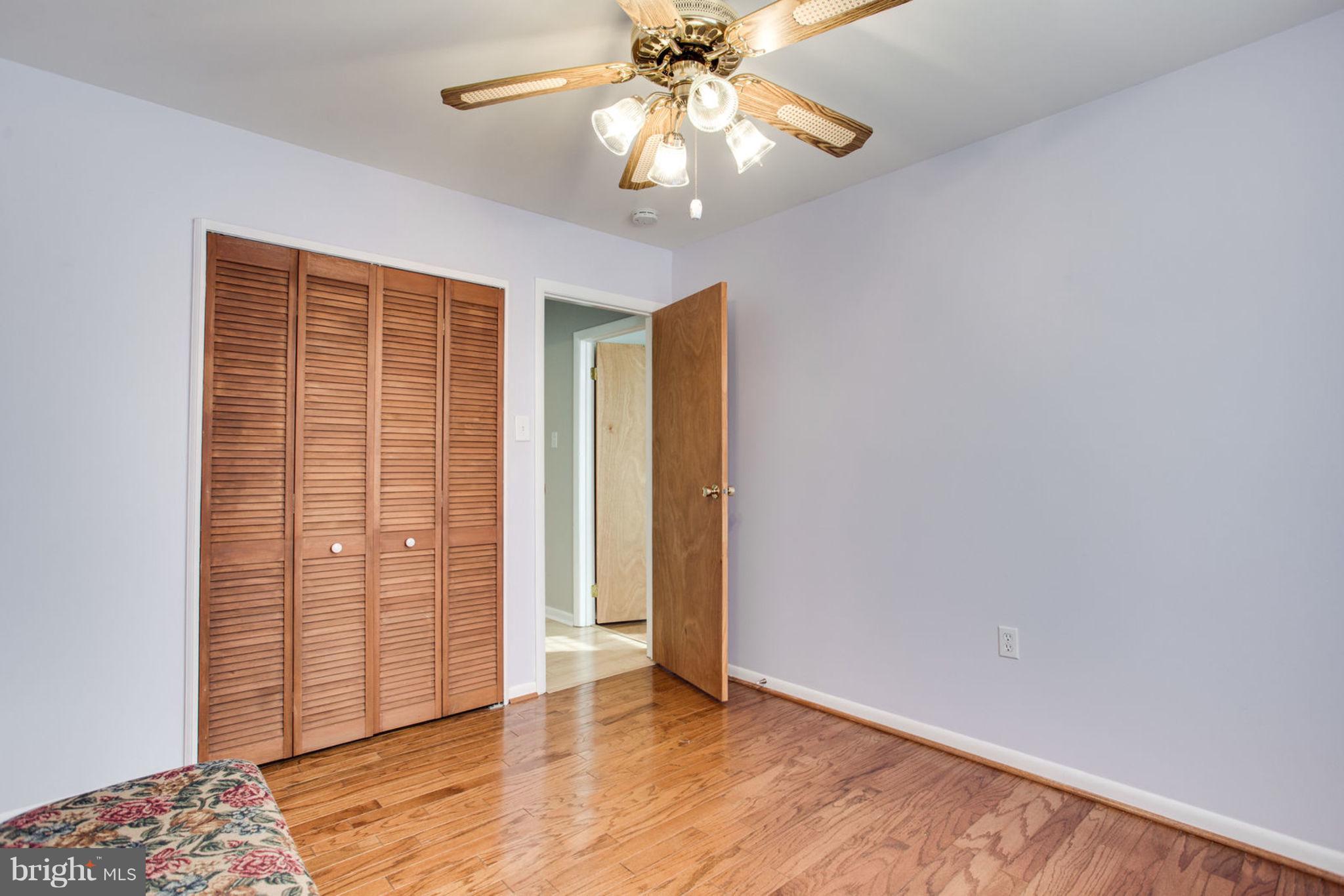 1625 Thomas Drive Point of Rocks, MD 21777 - Photo 30 of 47 an empty room with wooden floor closet and chandelier fan
