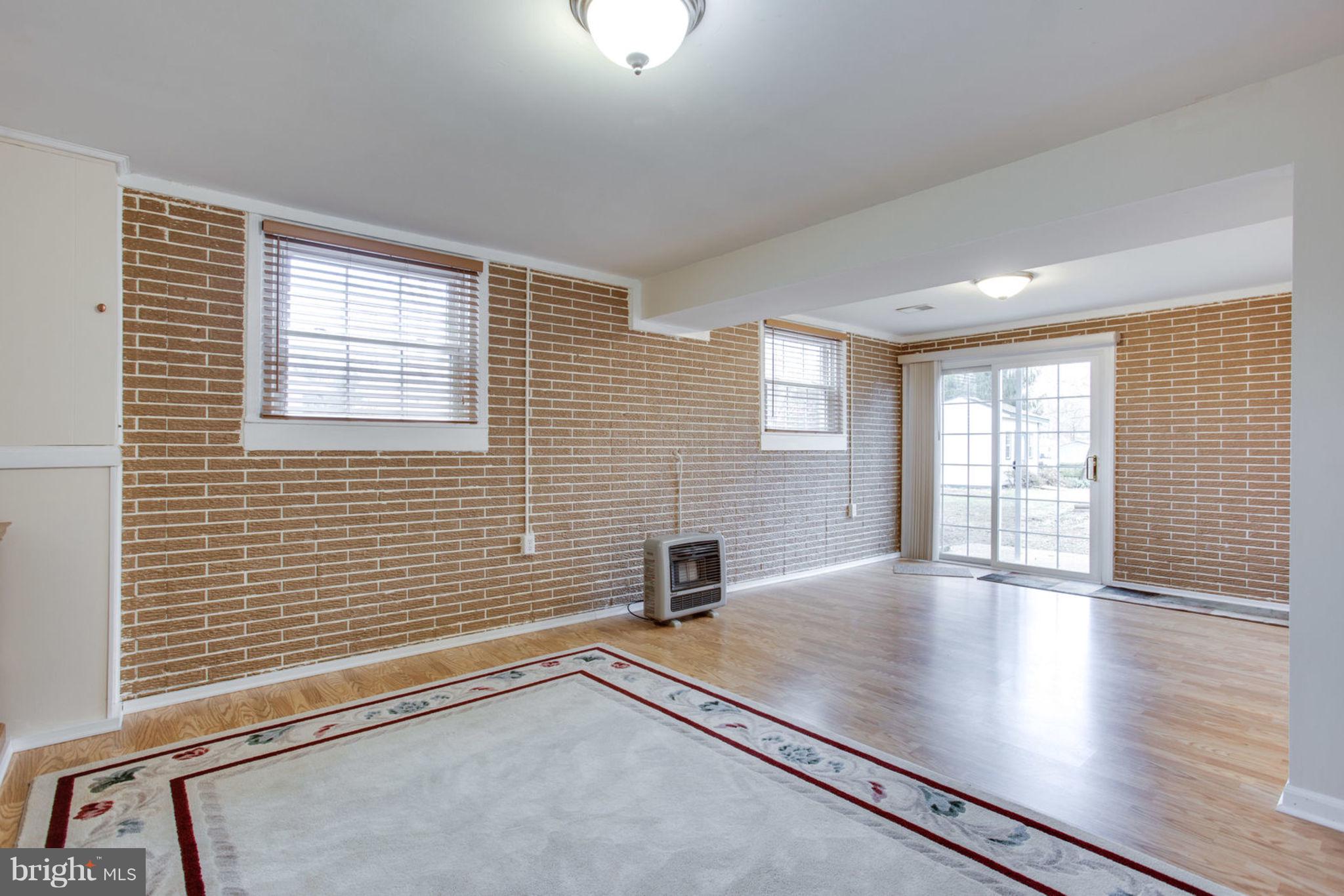 1625 Thomas Drive Point of Rocks, MD 21777 - Photo 33 of 47 a view of an empty room with a window and wooden floor