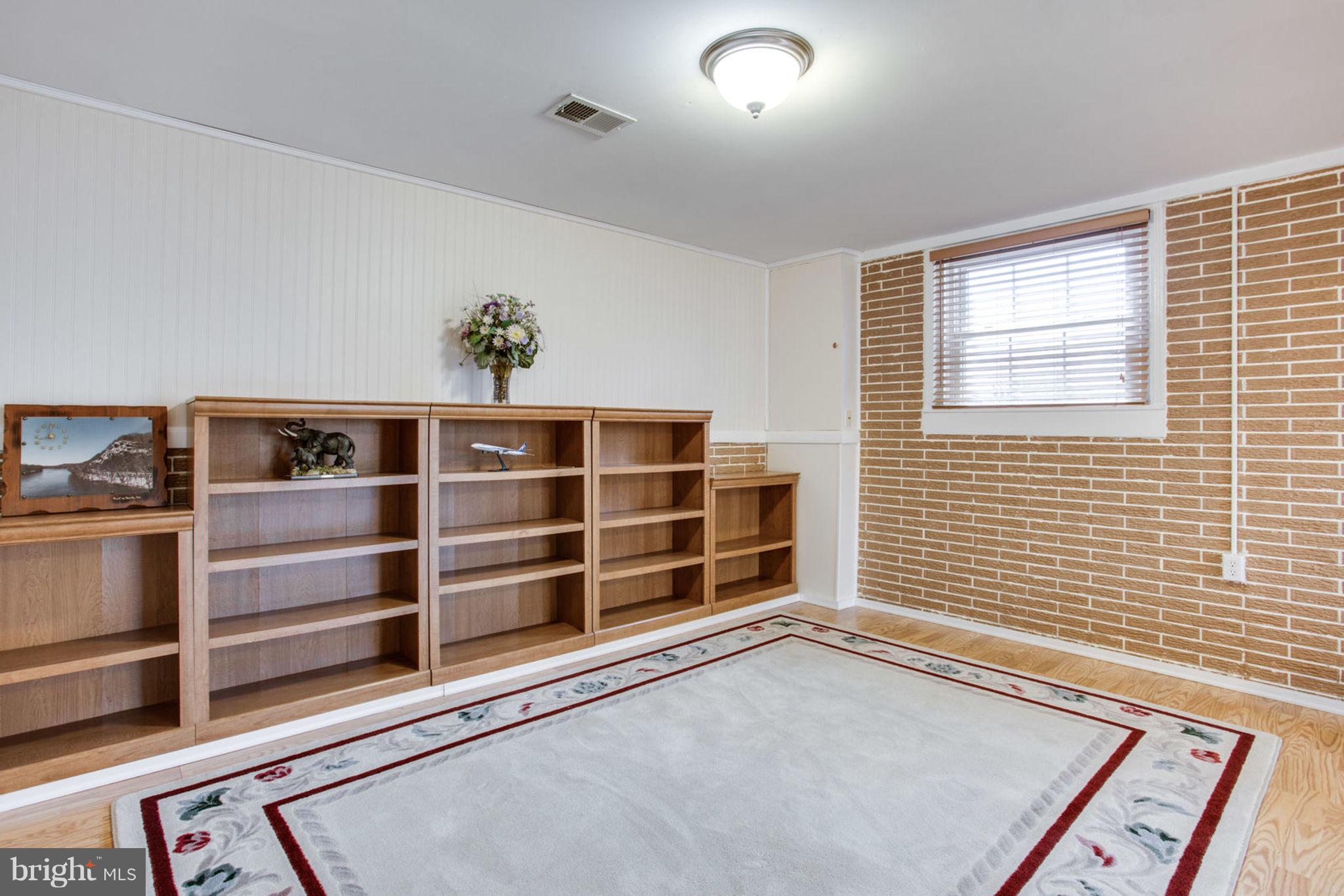 1625 Thomas Drive Point of Rocks, MD 21777 - Photo 34 of 47 a view of an empty room with a window and a bookshelf