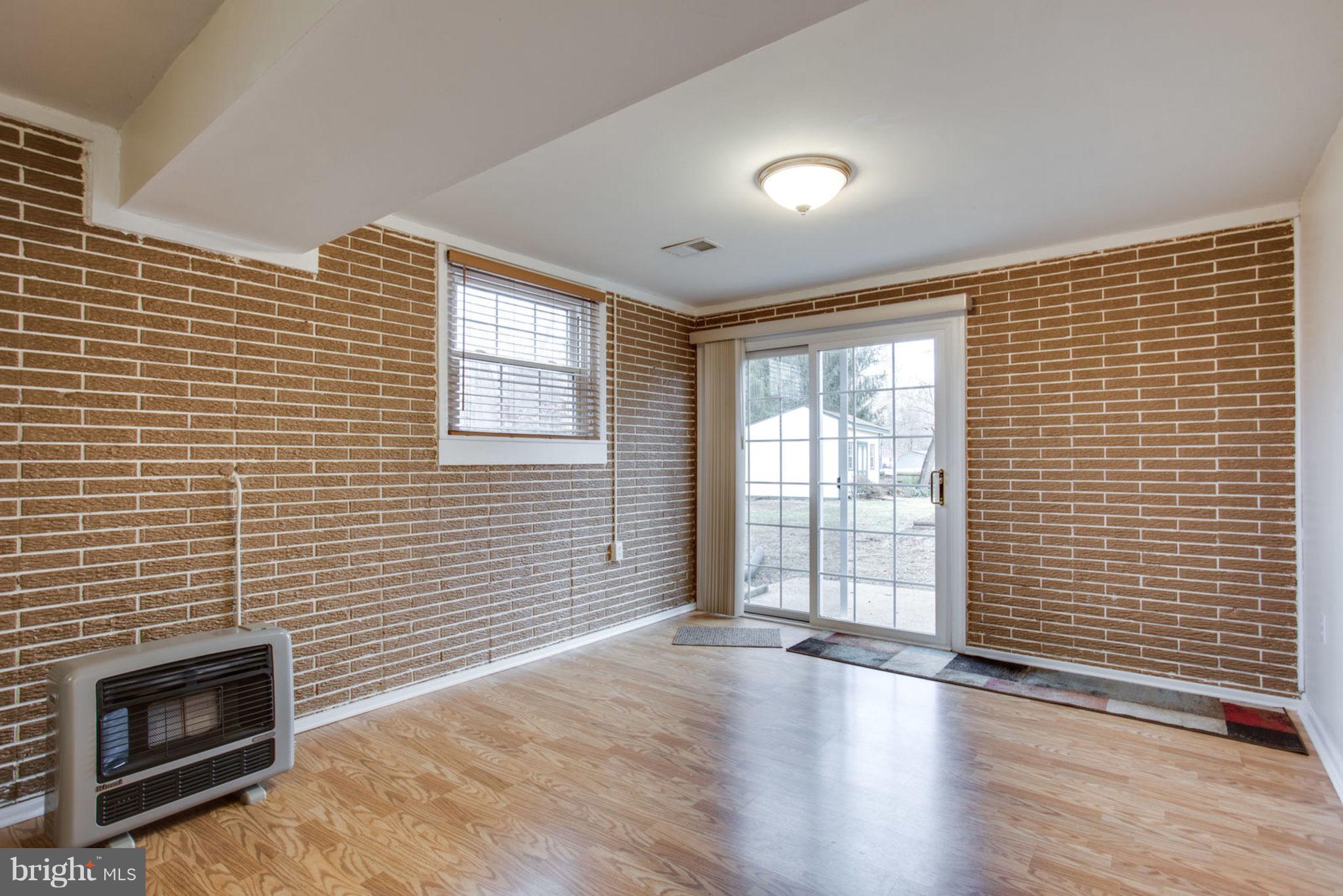 1625 Thomas Drive Point of Rocks, MD 21777 - Photo 35 of 47 a view of a livingroom with wooden floor and a fireplace