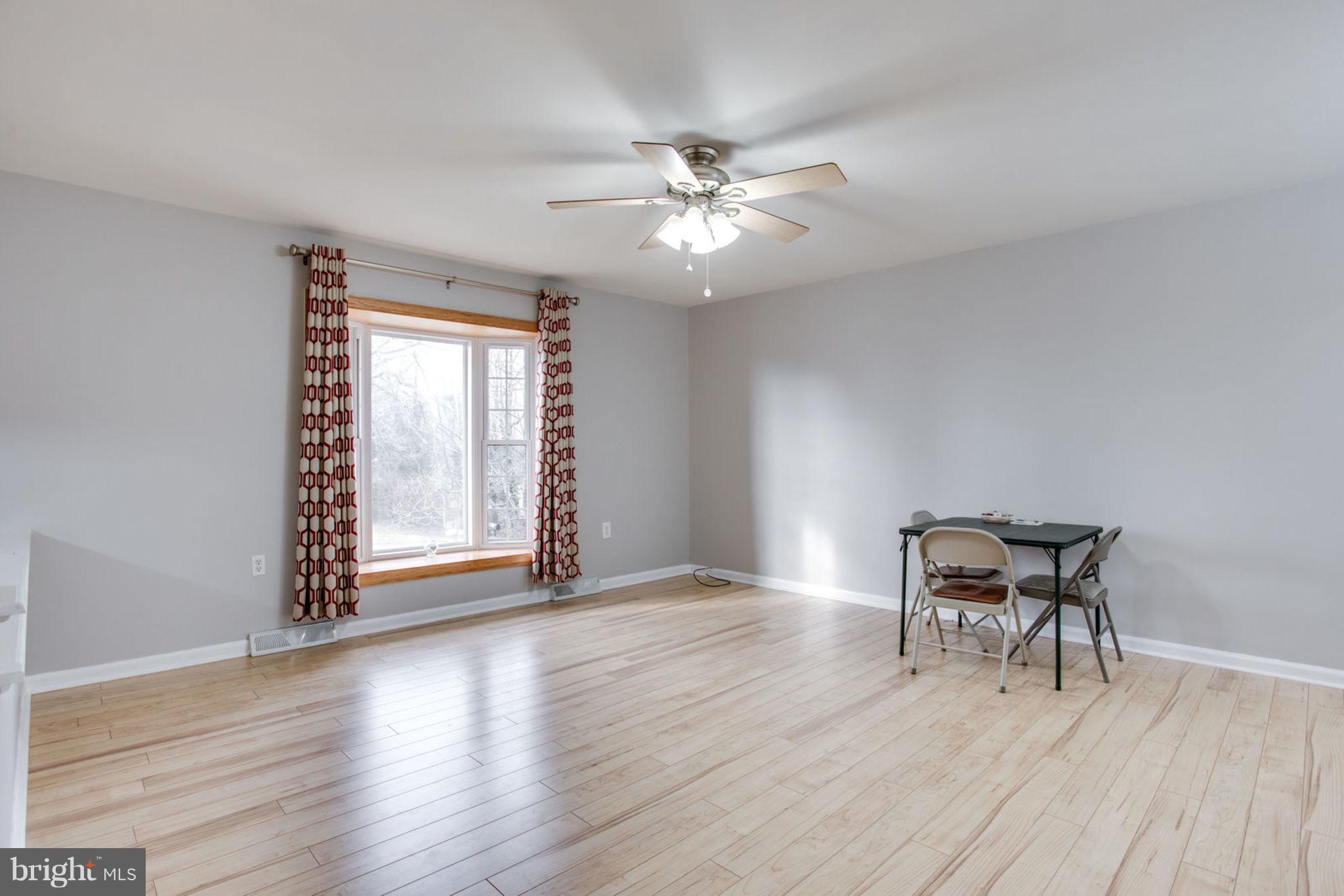 1625 Thomas Drive Point of Rocks, MD 21777 - Photo 7 of 47 a view of a livingroom with furniture and chandelier fan