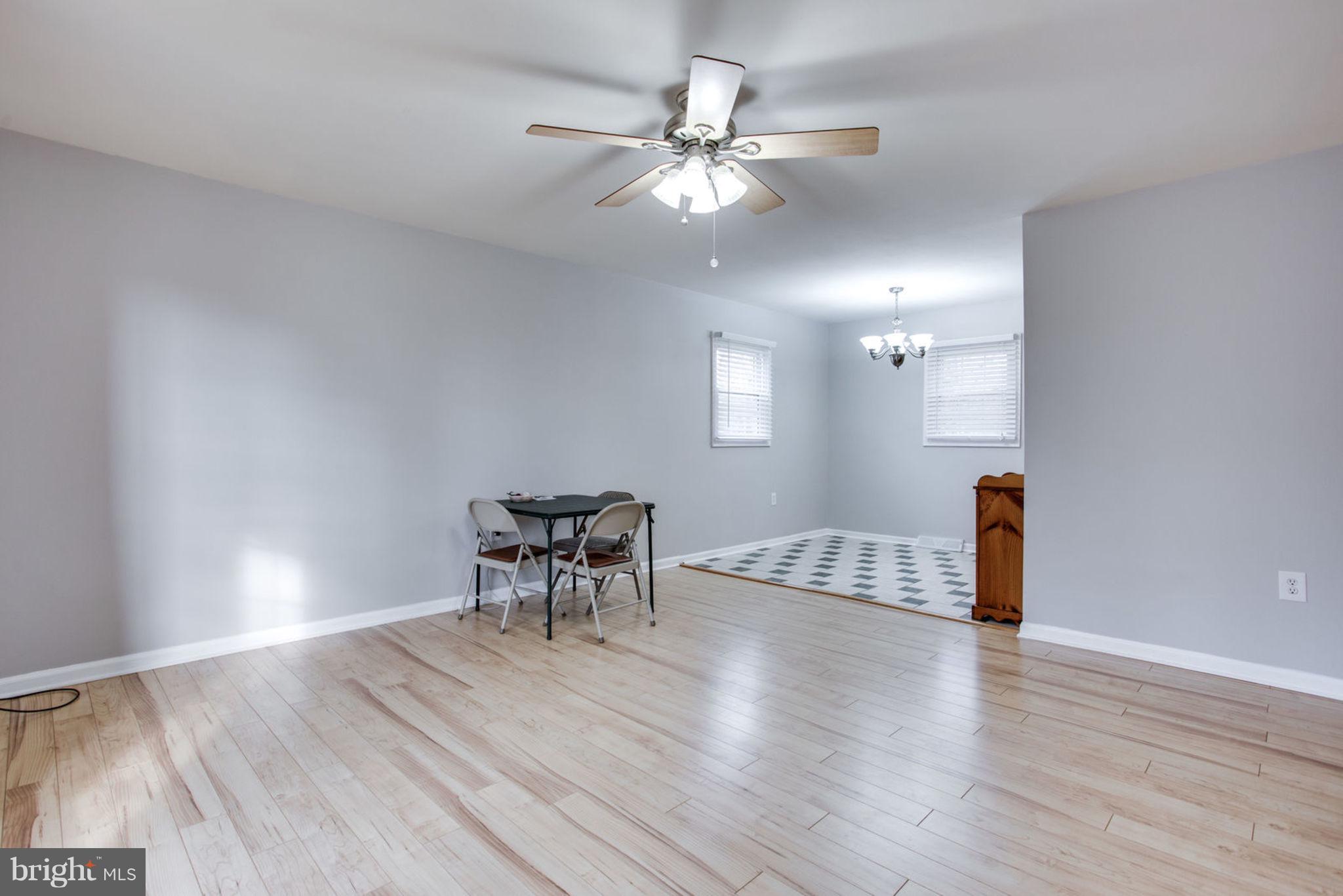 1625 Thomas Drive Point of Rocks, MD 21777 - Photo 8 of 47 a view of a livingroom with wooden floor and a ceiling fan
