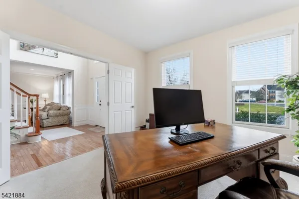 a view of a workspace with furniture