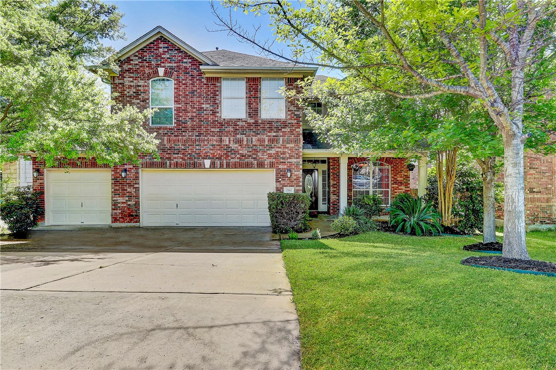 2767 Grimes Ranch Road Austin, TX 78732 - Photo 1 of 1 a front view of a house with a yard