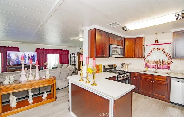 a kitchen that has a lot of cabinets in it