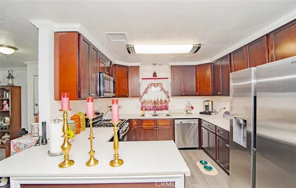 a kitchen with a sink a stove and cabinets