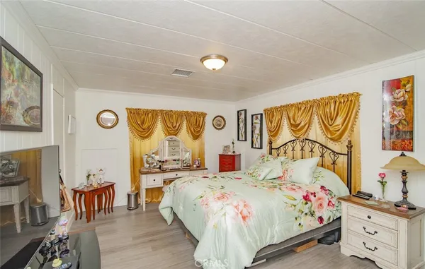 a bed room with a bed and a chair