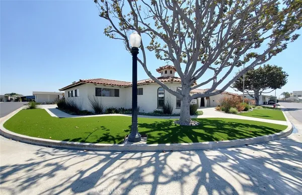 a view of a patio with table and chairs and potted plants