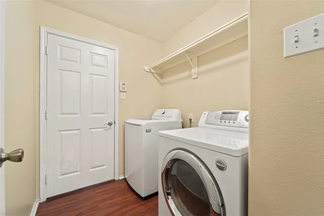 a view of storage and utility room with washer and dryer