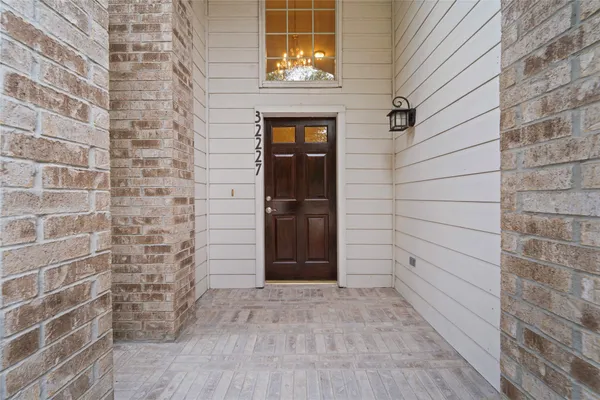 a view of a wooden door of the house