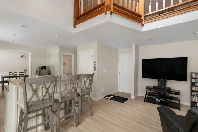 a view of a livingroom with furniture and a flat screen tv