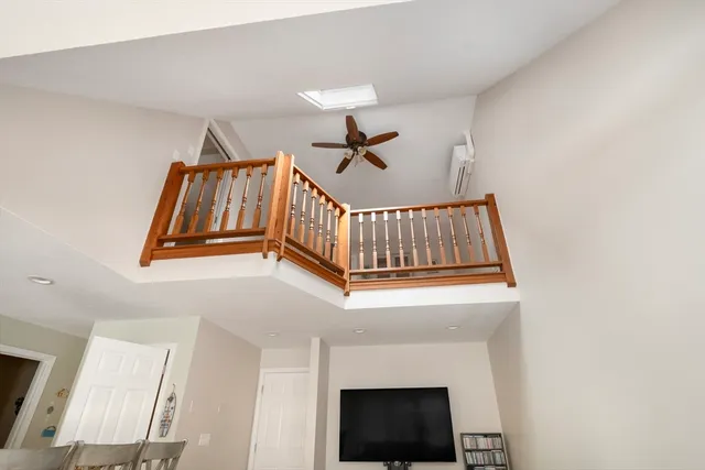 a view of a workspace with furniture and wooden floor