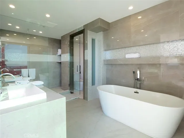 a bathroom with a bathtub and a sink