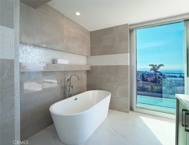 a white bath tub sitting in a bathroom