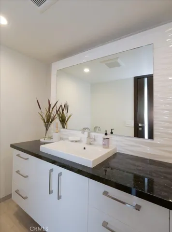 a close view of sink and mirror