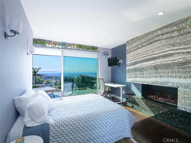 a bedroom with a bed and a fireplace