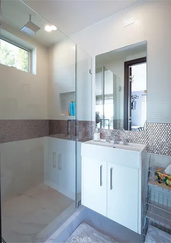 a bathroom with a sink and a mirror