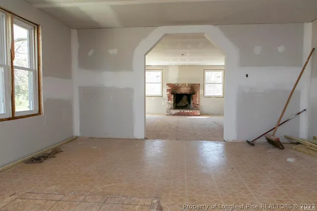 a living room with a fireplace