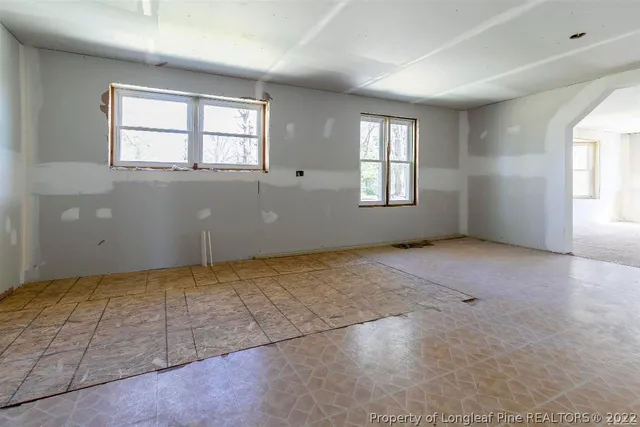 a view of a forest with a yard