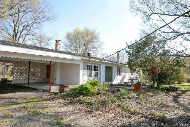 a house with trees in front of it