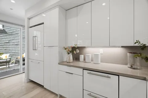 a kitchen with cabinets and window