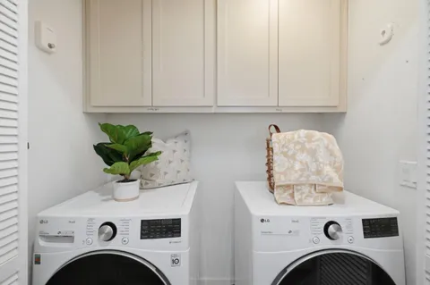 a view of livingroom with washer and dryer