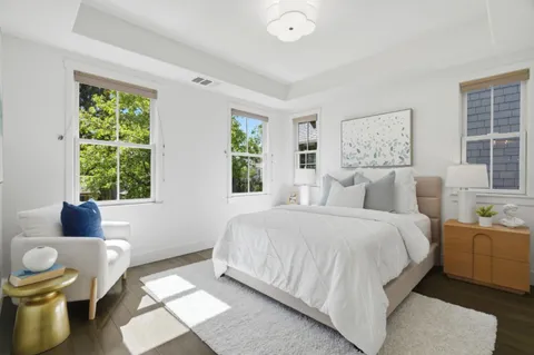 a spacious bedroom with a bed and a couch