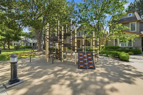 a view of a park with sitting area