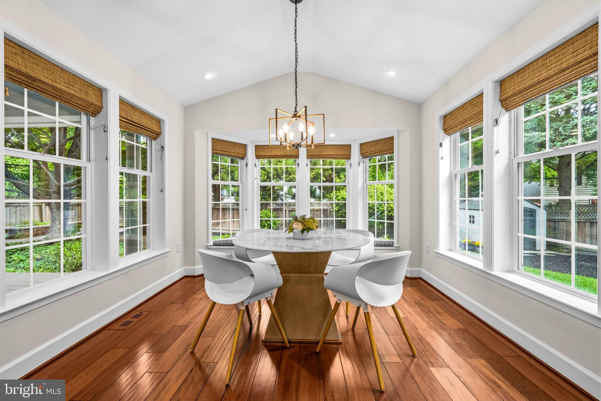 4007 West Braddock Road Alexandria, VA 22304 - Photo 17 of 52 a dining room with furniture large windows and wooden floor