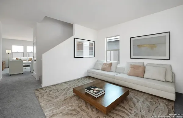 a living room with furniture and a couch