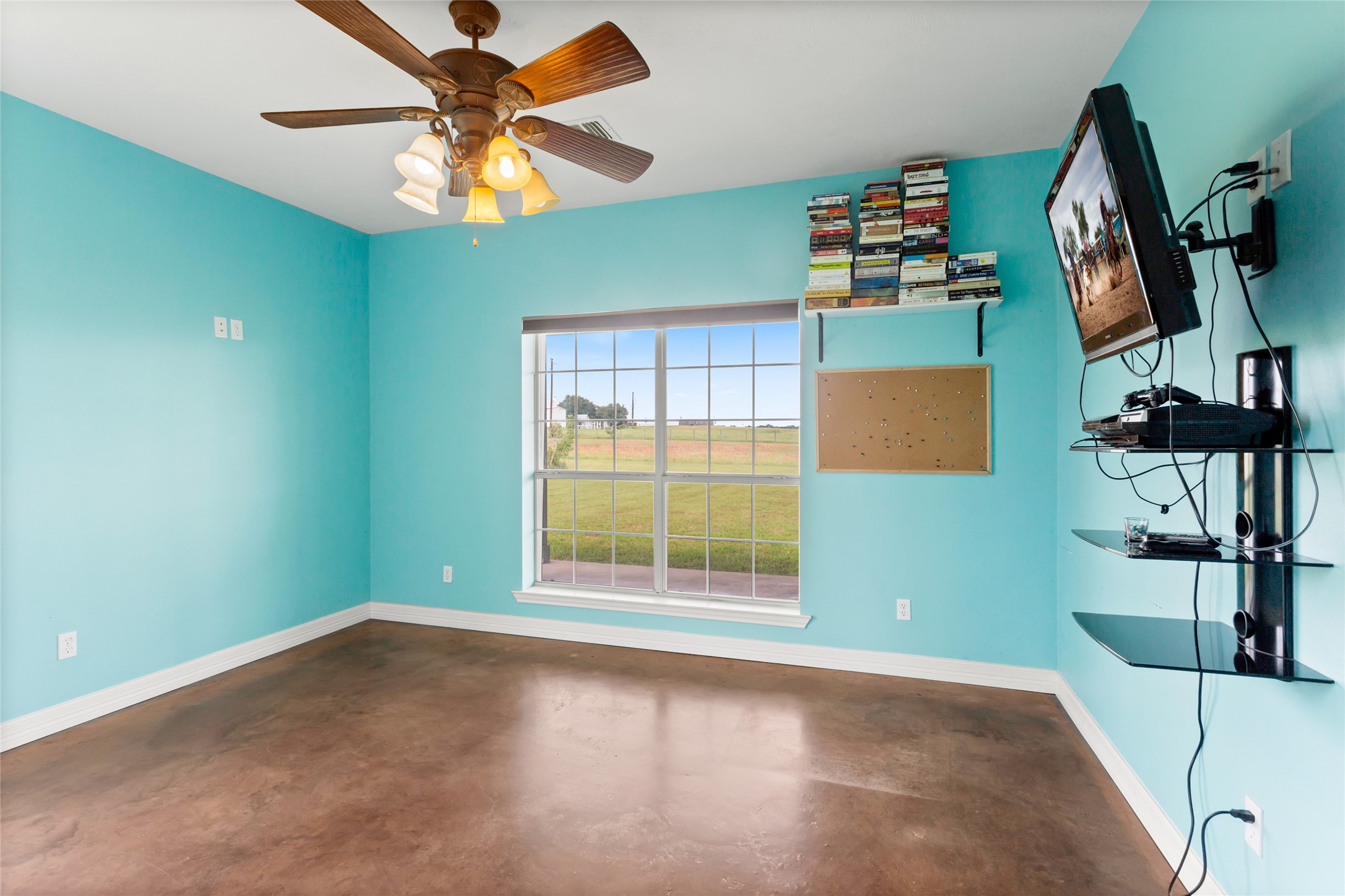 5750 Cedar Hill Road Brenham, TX 77833 - Photo 36 of 46 Bathed in natural light, the third bedroom's large windows showcase breathtaking views. Both additional bedrooms offer substantial, identical closets, thoughtfully equipped with hanging space and drawers.