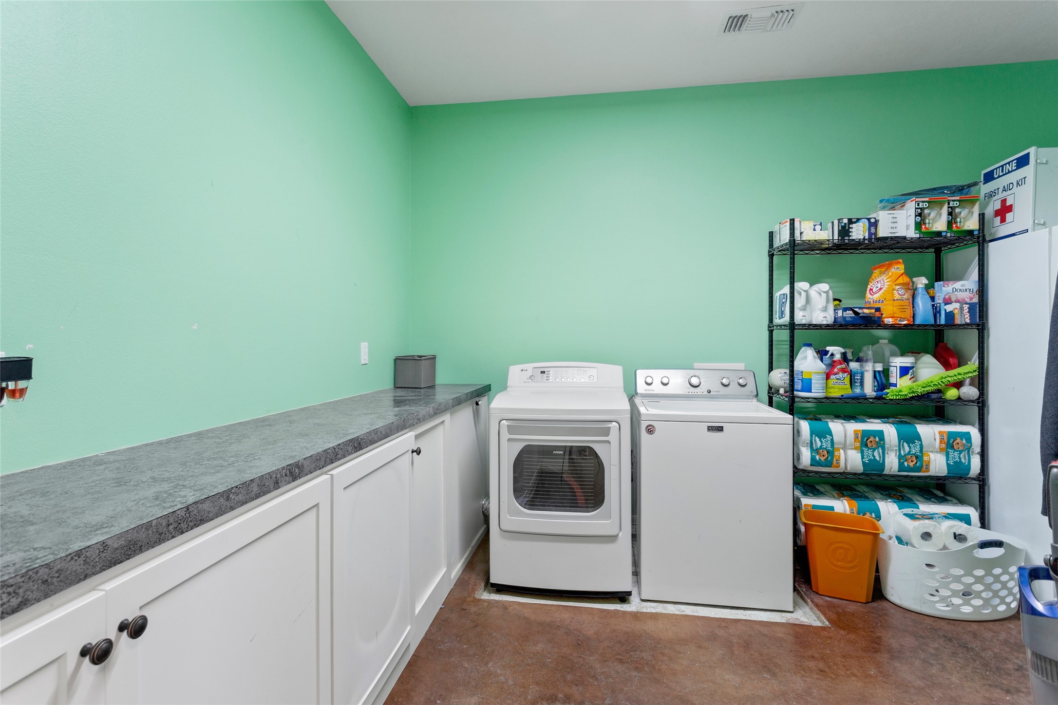 5750 Cedar Hill Road Brenham, TX 77833 - Photo 39 of 46 You'll love the incredible storage in this humongous laundry room, featuring tons of cabinets with room for a washer/dryer, extra fridge, and beyond!
