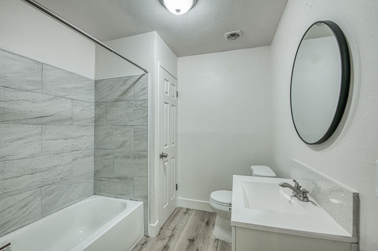 29531 Morgan Canyon Road Prather, CA 93651 - Photo 18 of 42 a bathroom with a sink a toilet and a bathtub
