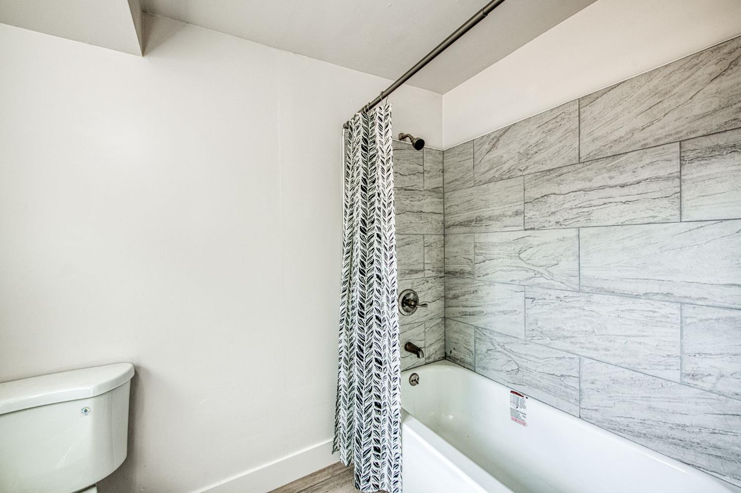 29531 Morgan Canyon Road Prather, CA 93651 - Photo 19 of 42 a bathroom with a bathtub and shower