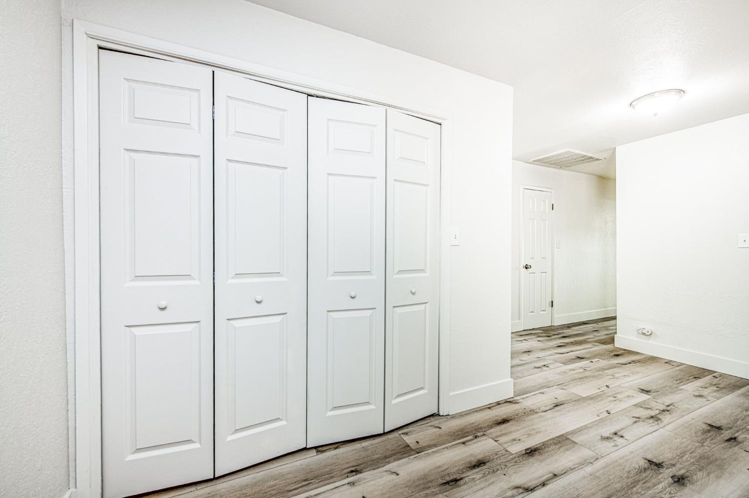 29531 Morgan Canyon Road Prather, CA 93651 - Photo 10 of 42 an empty room with wooden floor