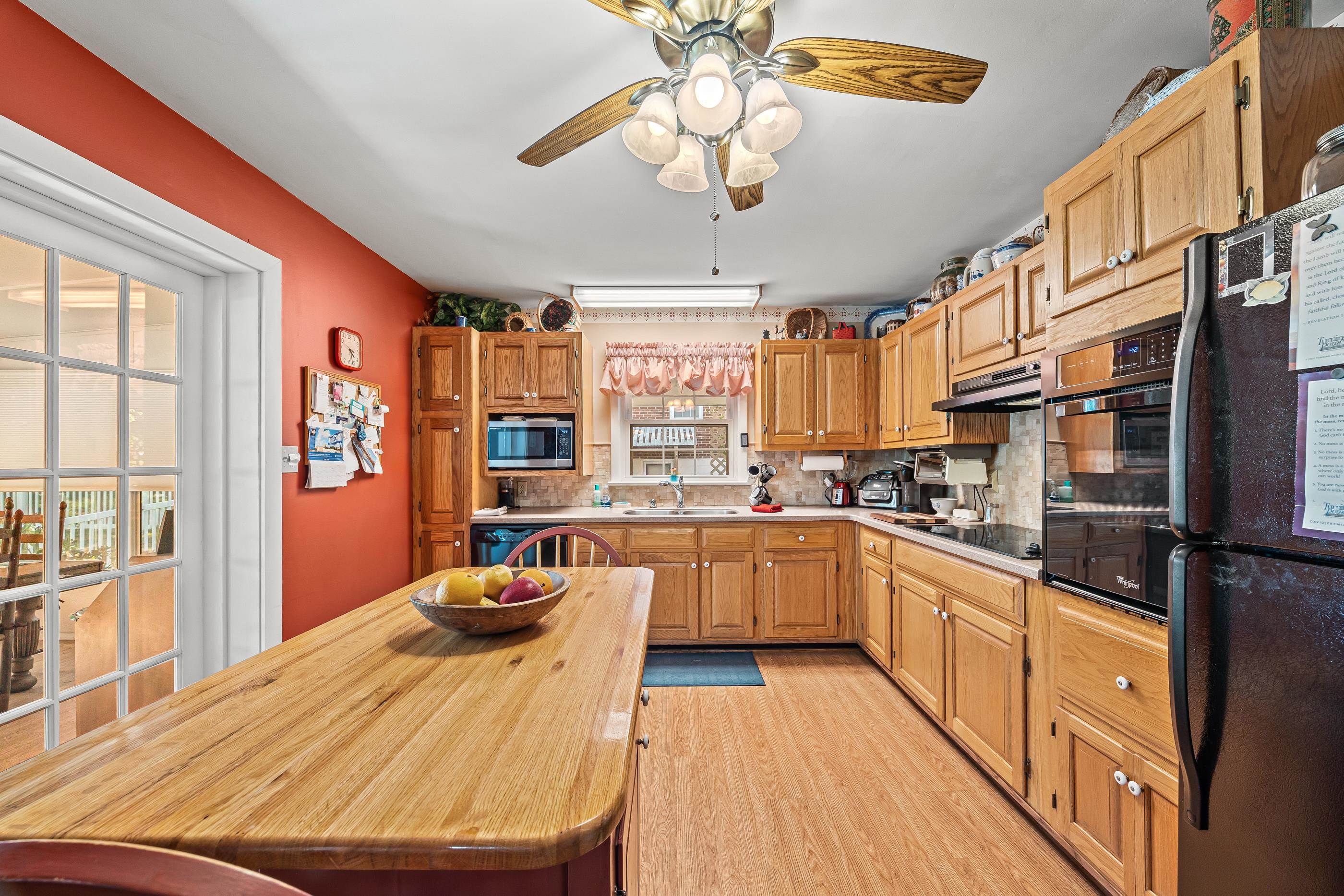 208 Tuxedo Road Staunton, VA 24401 - Photo 15 of 46 a kitchen with stainless steel appliances granite countertop a stove refrigerator dining table and chairs