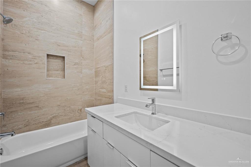 2716 East Conroe Road Edinburg, TX 78542 - Photo 21 of 31 Full bathroom featuring shower / bathtub combination and vanity