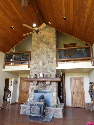 a room with fireplace and wooden floor