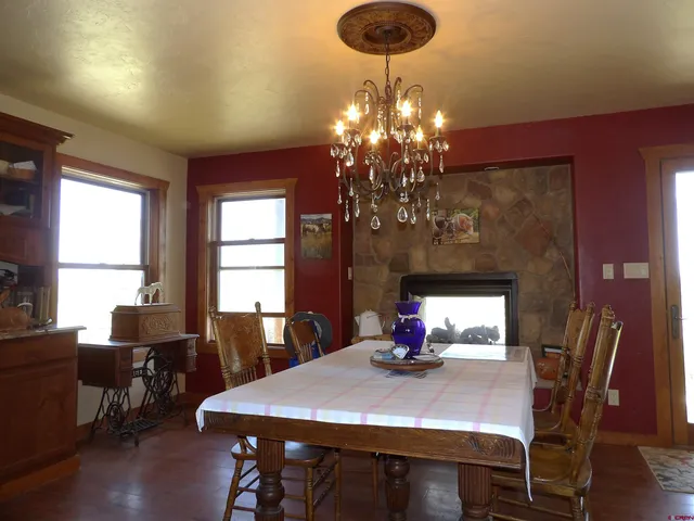 a kitchen with kitchen island granite countertop wooden cabinets and a sink