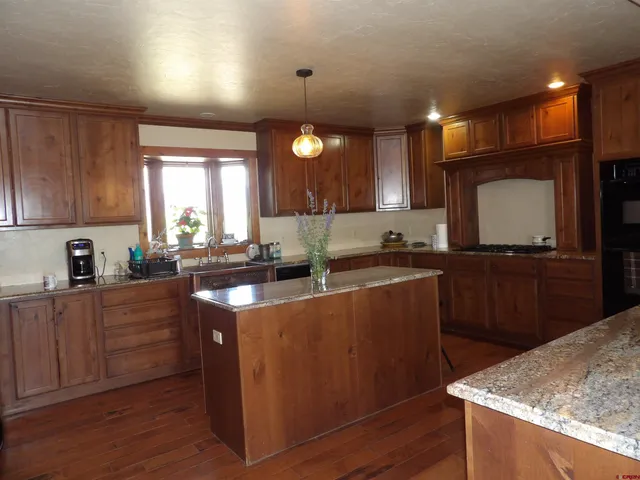 a kitchen with a sink and refrigerator