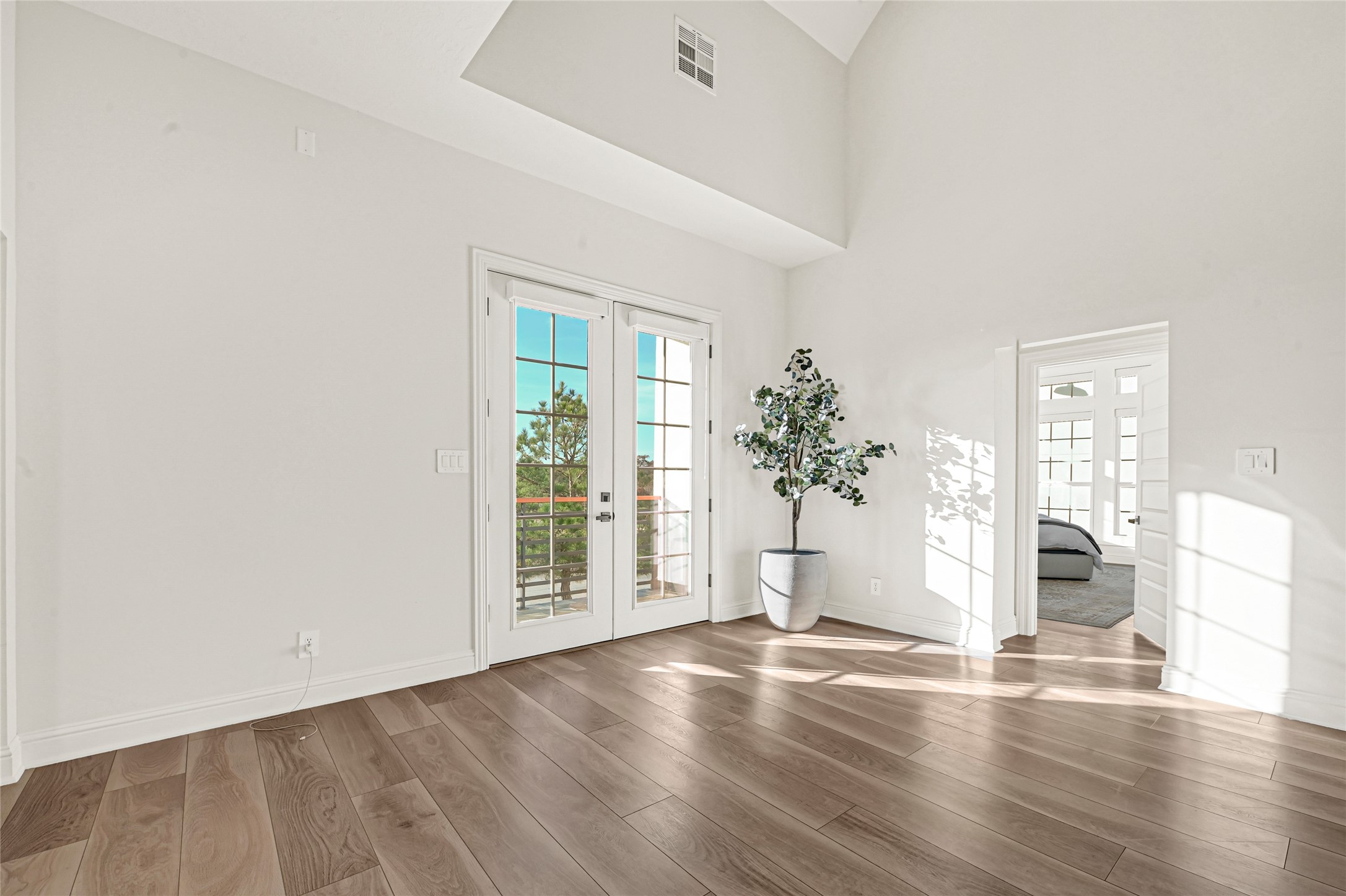 28811 Riley Road Waller, TX 77484 - Photo 33 of 50 an empty room with wooden floor and windows