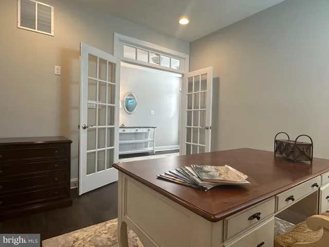 a kitchen with kitchen island a sink stove and cabinets