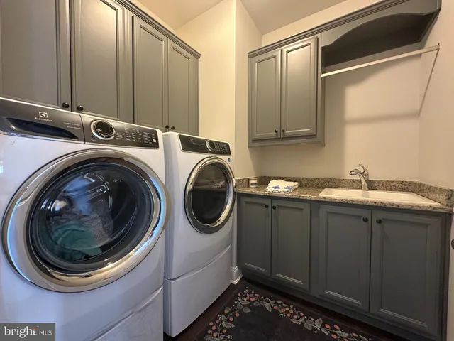 a large kitchen with lots of counter space a sink and appliances