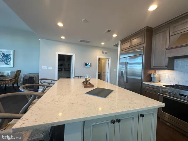 a view of a dining room with furniture wooden floor and a large window