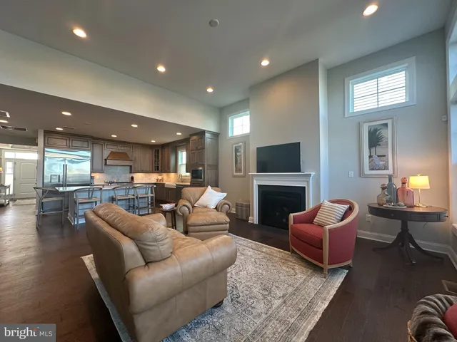 a living room with fireplace furniture and a flat screen tv