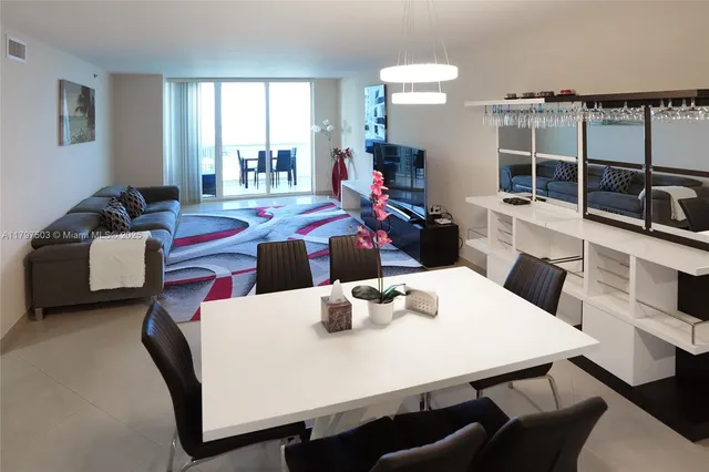 a view of a dining room with furniture and window