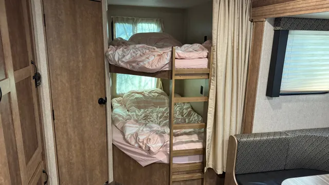 a view of bedroom with furniture and a window