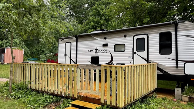 a front view of a house with wooden fence
