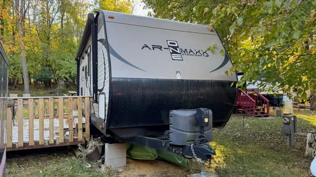 a view of backyard with a table and chairs